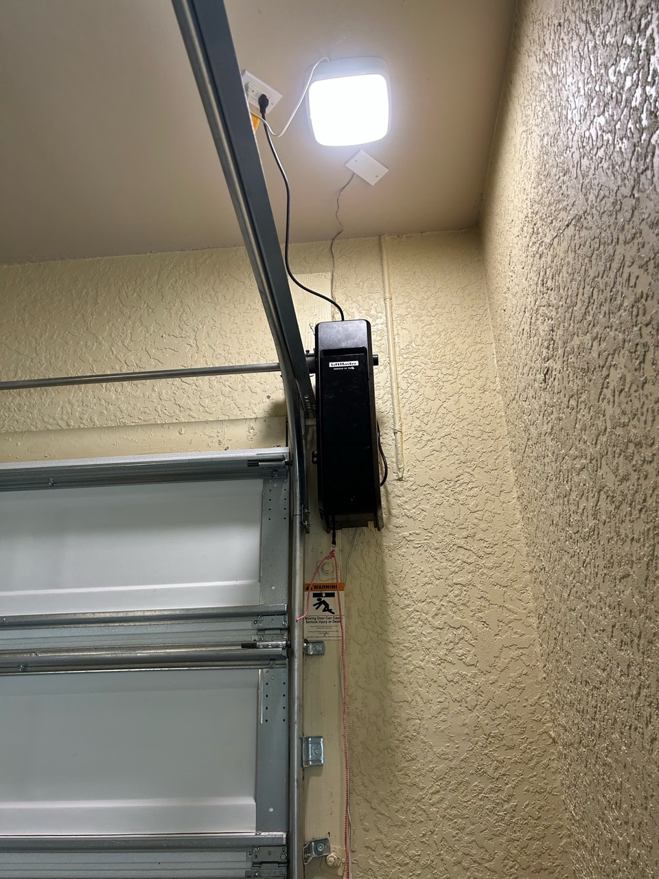 Is Your Garage Door Motor Acting Up? Don't Get Stuck in the Naples Heat!